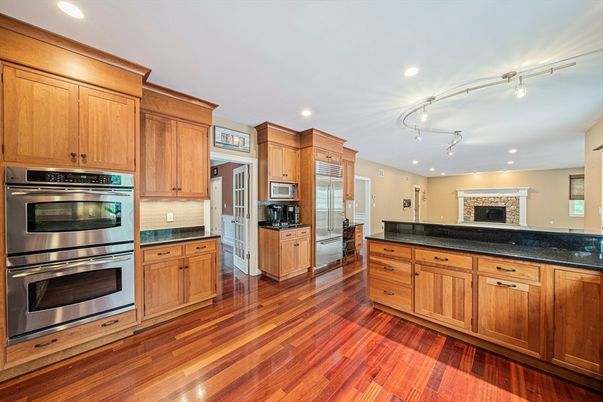 Fireplace, Interior, Kitchen, Recessed Lighting, Stainless Steel Appliances, Wood Texture Flooring