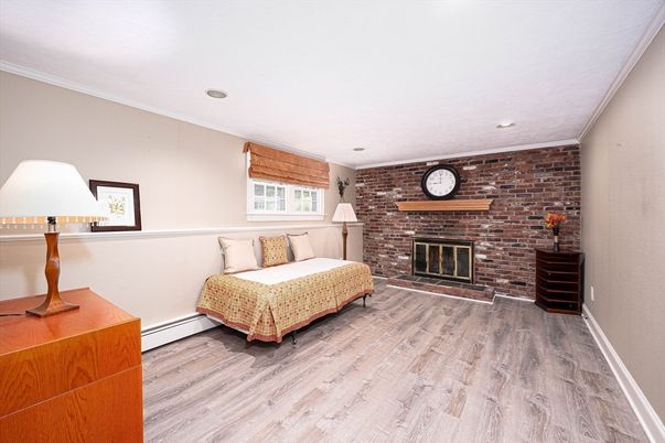 Bedroom, Fireplace, Interior, Recessed Lighting, Stone Walls, Wood Texture Flooring
