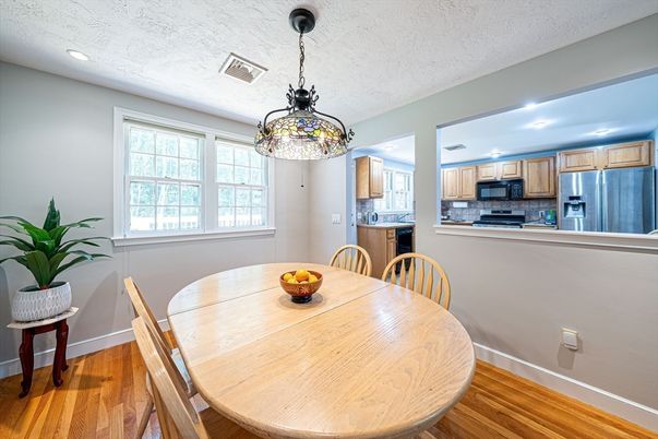 Dining room, Interior, Kitchen, Pendant Lights, Recessed Lighting, Stainless Steel Appliances, Wood Texture Flooring