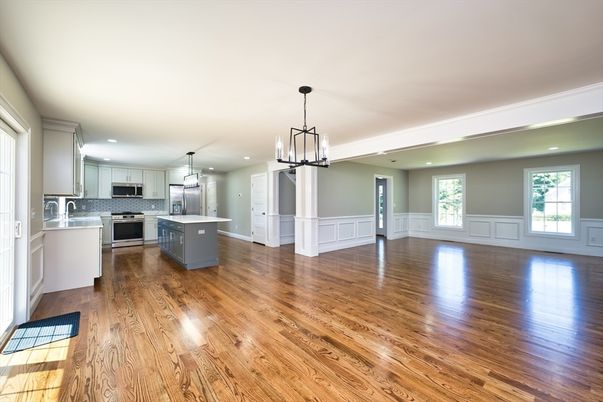 Empty room, Interior, Kitchen, Pendant Lights, Recessed Lighting, Stainless Steel Appliances, Wood Texture Flooring