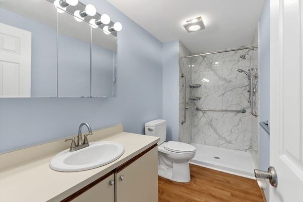 Bathroom, Glass Shower, Interior, Marble Walls, Wood Texture Flooring