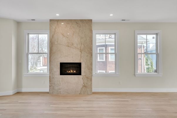Fireplace, Interior, Marble Walls, Recessed Lighting, Wood Texture Flooring