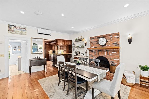 Dining room, Fireplace, Interior, Recessed Lighting, Stone Walls, Wood Texture Flooring
