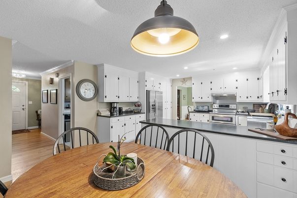 Dining room, Interior, Kitchen, Recessed Lighting, Stainless Steel Appliances, Wood Texture Flooring