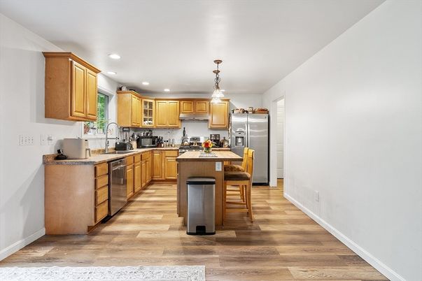 Dining room, Interior, Kitchen, Pendant Lights, Recessed Lighting, Stainless Steel Appliances, Wood Texture Flooring