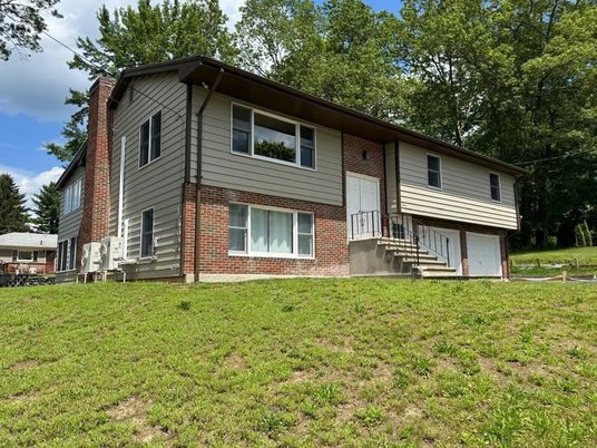 Attached, Backyard, Exterior, Facade, Brick Facade, Raised Ranch