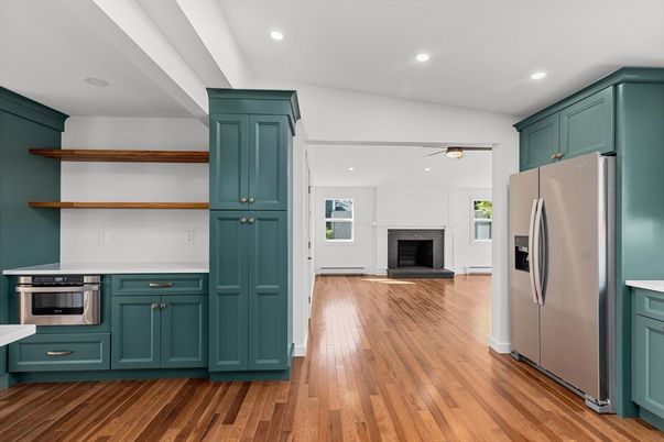 Fireplace, Interior, Kitchen, Recessed Lighting, Stainless Steel Appliances, Wood Texture Flooring