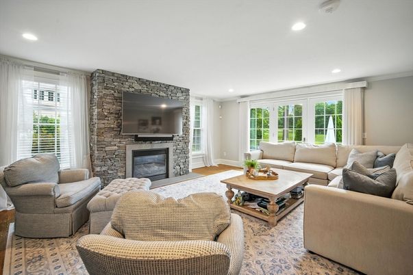 Fireplace, Interior, Living room, Recessed Lighting, Stone Walls, Wood Texture Flooring