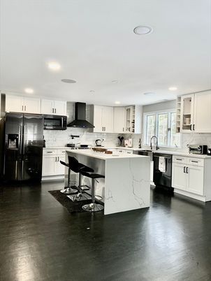 Interior, Kitchen, Marble Walls, Recessed Lighting, Stainless Steel Appliances, Wood Texture Flooring