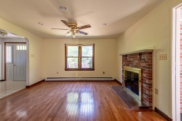 Empty room, Fireplace, Interior, Recessed Lighting, Stone Walls, Wood Texture Flooring