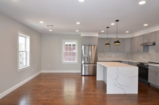 Interior, Kitchen, Marble Walls, Pendant Lights, Recessed Lighting, Stainless Steel Appliances, Wood Texture Flooring