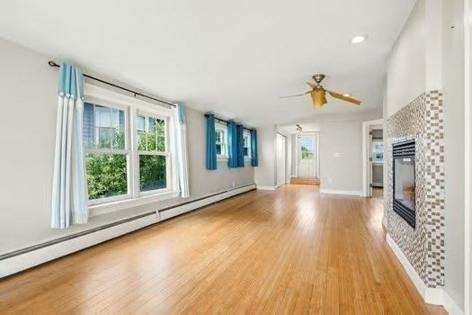 Empty room, Interior, Kitchen, Recessed Lighting, Stainless Steel Appliances, Wood Texture Flooring