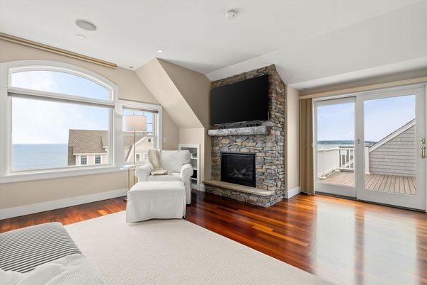 Fireplace, Interior, Recessed Lighting, Stone Walls, Water, Wood Texture Flooring