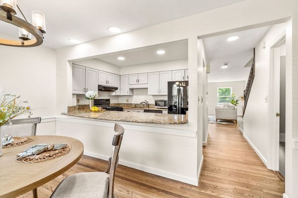 Dining room, Interior, Kitchen, Recessed Lighting, Stainless Steel Appliances, Wood Texture Flooring