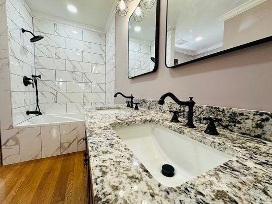 Bathroom, Dual Sink Vanities, Interior, Marble Walls, Recessed Lighting, Wood Texture Flooring