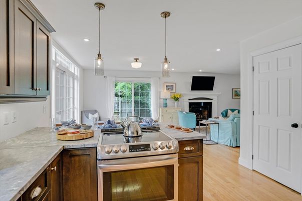 Fireplace, Interior, Kitchen, Living room, Pendant Lights, Recessed Lighting, Stainless Steel Appliances, Wood Texture Flooring