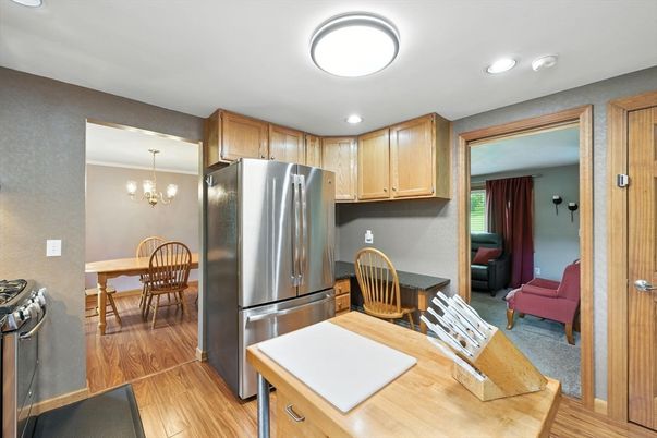 Chandelier, Dining room, Interior, Kitchen, Recessed Lighting, Stainless Steel Appliances, Wood Texture Flooring