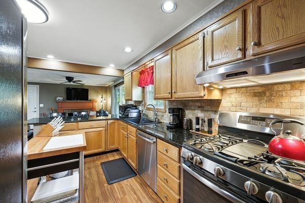 Interior, Kitchen, Recessed Lighting, Stainless Steel Appliances, Stone Walls, Wood Texture Flooring