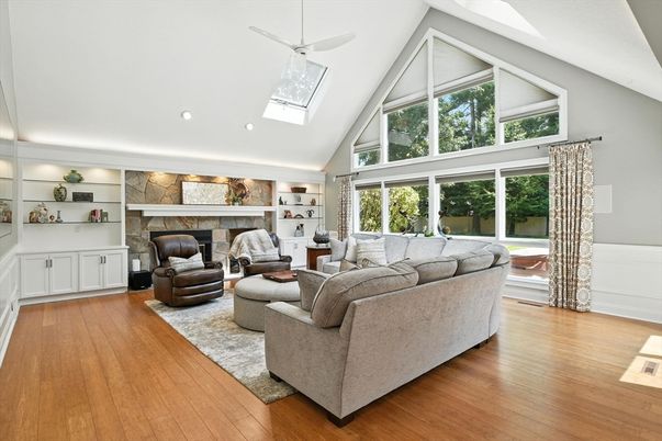 Fireplace, Interior, Living room, Recessed Lighting, Stone Walls, Wood Texture Flooring
