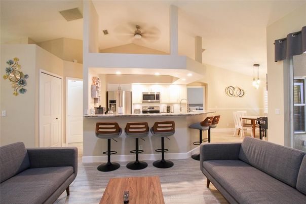 Interior, Kitchen, Wood Texture Flooring, Recessed Lighting, Living room, Dining room, Stainless Steel Appliances, Pendant Lights
