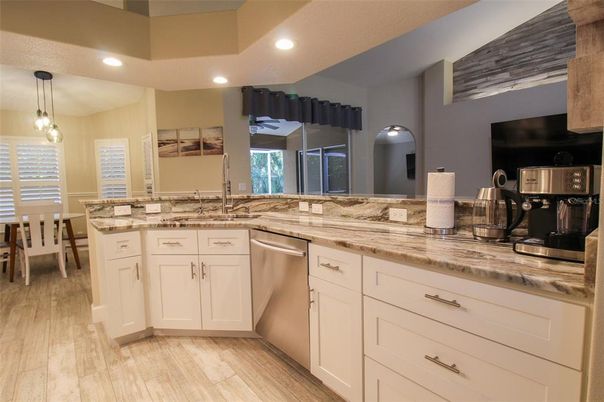 Interior, Kitchen, Wood Texture Flooring, Recessed Lighting, Dining room, Stainless Steel Appliances, Pendant Lights