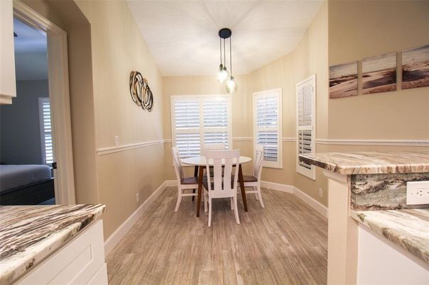 Interior, Kitchen, Wood Texture Flooring, Dining room, Stainless Steel Appliances, Pendant Lights