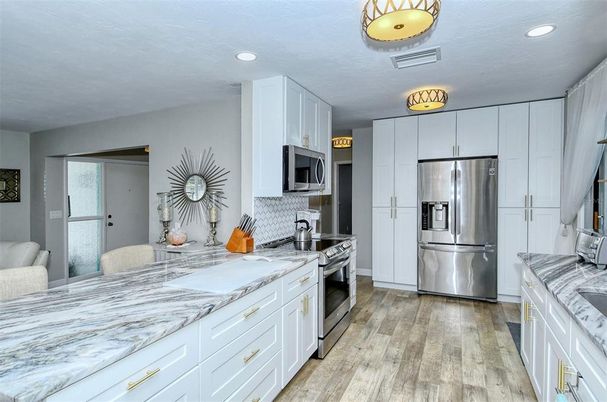 Interior, Kitchen, Recessed Lighting, Stainless Steel Appliances, Wood Texture Flooring