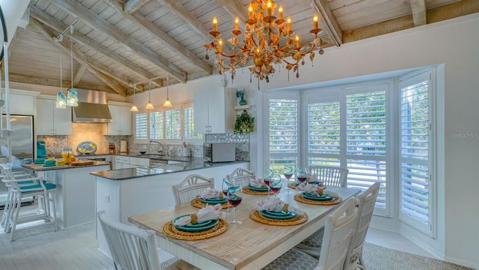Chandelier, Dining room, Interior, Kitchen, Pendant Lights, Stainless Steel Appliances, Wooden Beams, Wooden Ceilings, Wood Texture Flooring