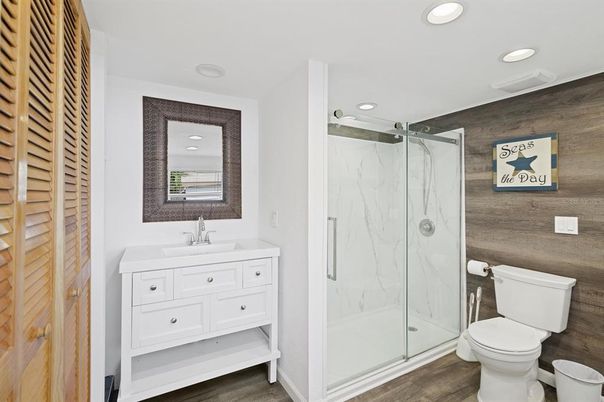 Bathroom, Glass Shower, Interior, Marble Walls, Recessed Lighting, Wood Texture Flooring
