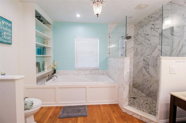 Interior, Bathroom, Wood Texture Flooring, Recessed Lighting, Glass Shower, Marble Walls, Pendant Lights