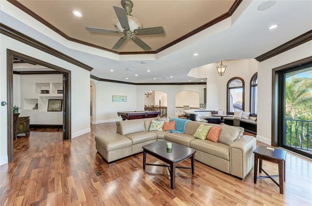 Billiard Table, Chandelier, Game Room, Interior, Living room, Pendant Lights, Recessed Lighting, Wood Texture Flooring