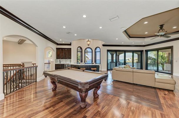 Billiard Table, Fireplace, Game Room, Interior, Living room, Recessed Lighting, Wood Texture Flooring