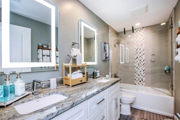 Bathroom, Dual Sink Vanities, Glass Shower, Interior, Recessed Lighting, Wood Texture Flooring