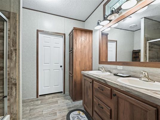 Bathroom, Dual Sink Vanities, Glass Shower, Interior, Wood Texture Flooring