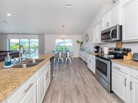 Chandelier, Dining room, Interior, Kitchen, Pendant Lights, Recessed Lighting, Wood Texture Flooring