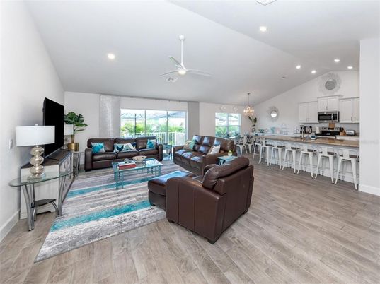 Chandelier, Dining room, Interior, Kitchen, Living room, Recessed Lighting, Stainless Steel Appliances, Wood Texture Flooring