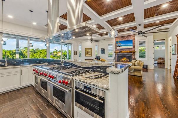 Fireplace, Interior, Kitchen, Living room, Pendant Lights, Recessed Lighting, Stainless Steel Appliances, Wooden Ceilings, Wood Texture Flooring
