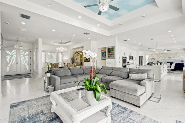 Chandelier, Interior, Kitchen, Living room, Marble, Pendant Lights, Recessed Lighting, Stainless Steel Appliances, Stone Walls