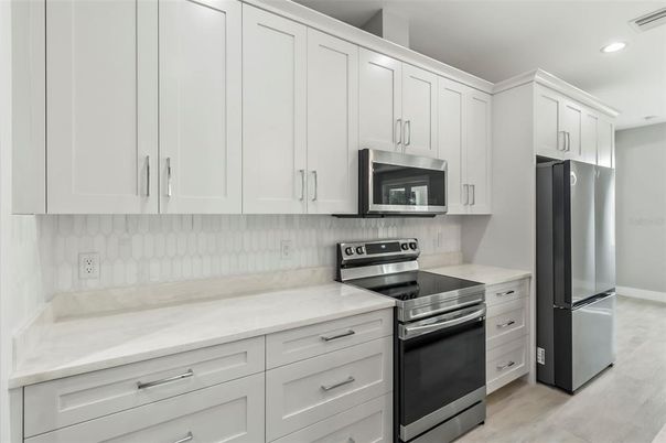 Interior, Kitchen, Recessed Lighting, Stainless Steel Appliances, Wood Texture Flooring