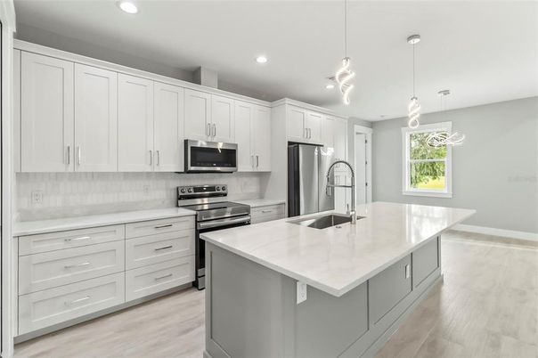 Interior, Kitchen, Pendant Lights, Recessed Lighting, Stainless Steel Appliances, Wood Texture Flooring