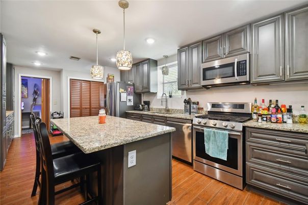 Interior, Kitchen, Pendant Lights, Recessed Lighting, Stainless Steel Appliances, Wood Texture Flooring