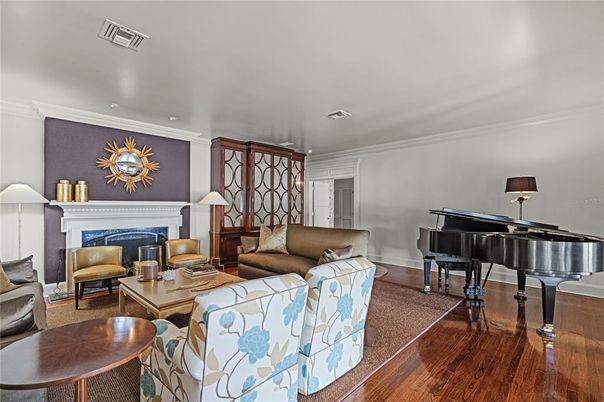 Fireplace, Interior, Living room, Piano, Recessed Lighting, Wood Texture Flooring