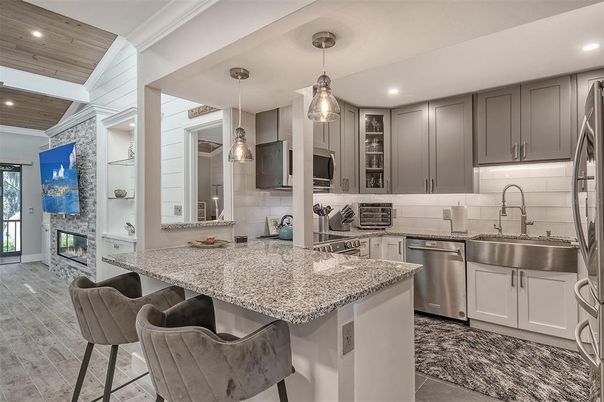 Fireplace, Interior, Kitchen, Pendant Lights, Recessed Lighting, Stainless Steel Appliances, Wooden Ceilings, Wood Texture Flooring