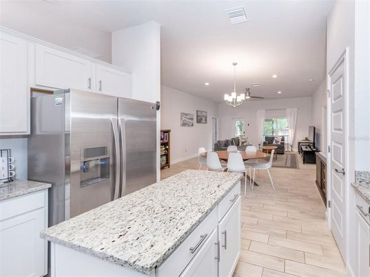 Chandelier, Dining room, Interior, Kitchen, Pendant Lights, Recessed Lighting, Stainless Steel Appliances, Wood Texture Flooring