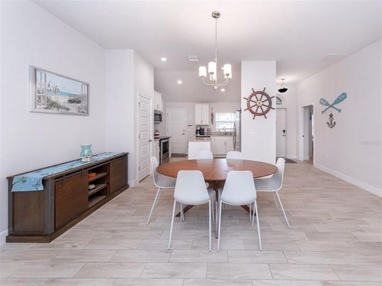 Chandelier, Dining room, Interior, Kitchen, Pendant Lights, Recessed Lighting, Stainless Steel Appliances, Wood Texture Flooring