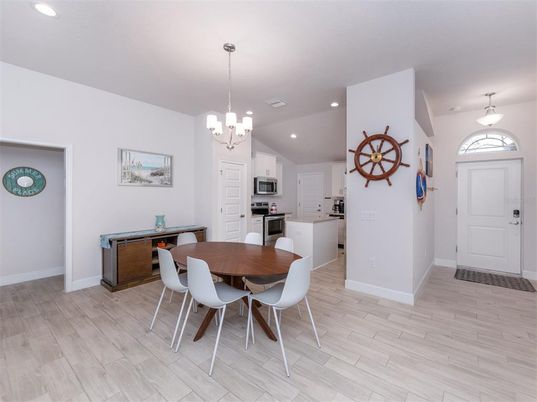 Chandelier, Dining room, Interior, Kitchen, Pendant Lights, Recessed Lighting, Stainless Steel Appliances, Wood Texture Flooring