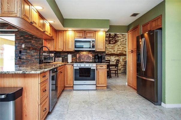 Dining room, Interior, Kitchen, Recessed Lighting, Stainless Steel Appliances, Stone Walls