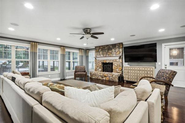 Fireplace, Interior, Living room, Recessed Lighting, Stone Walls, Wood Texture Flooring