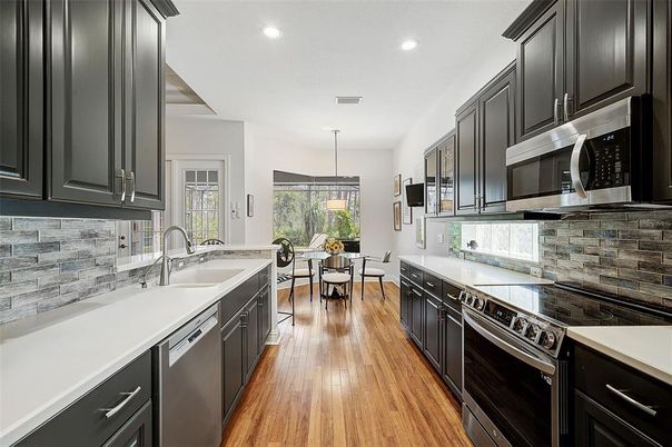 Dining room, Interior, Kitchen, Pendant Lights, Recessed Lighting, Stainless Steel Appliances, Wood Texture Flooring