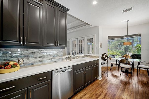 Dining room, Interior, Kitchen, Pendant Lights, Recessed Lighting, Stainless Steel Appliances, Wood Texture Flooring